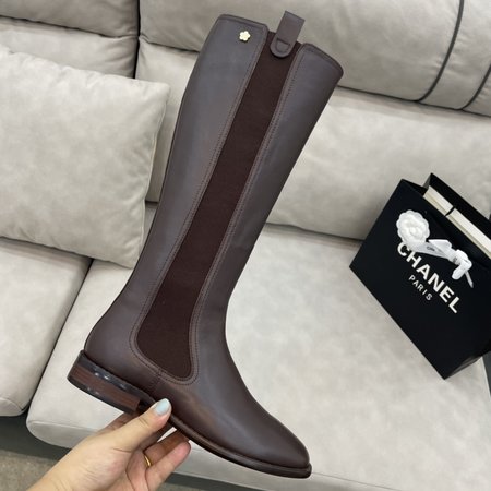 Chanel Knight s metal camellia logo on the back of the boot