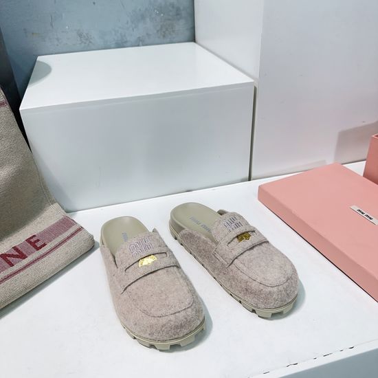 Miu Miu Classic Embossed Closed Toe Slip On Clogs
